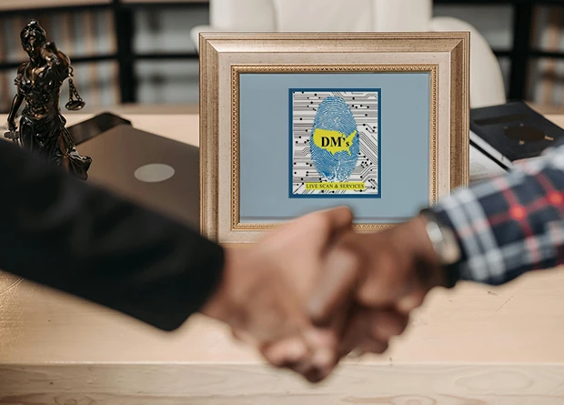 private-investigator-53b Lawyer and Client shaking hands in a live Scan office