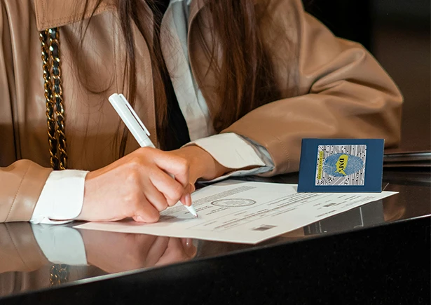 Notary woman signing a document in her office