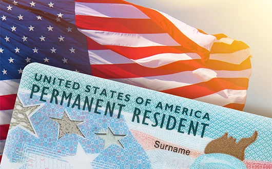 private-investigator-51 A Permanent Resident Card with a American Flag in the background