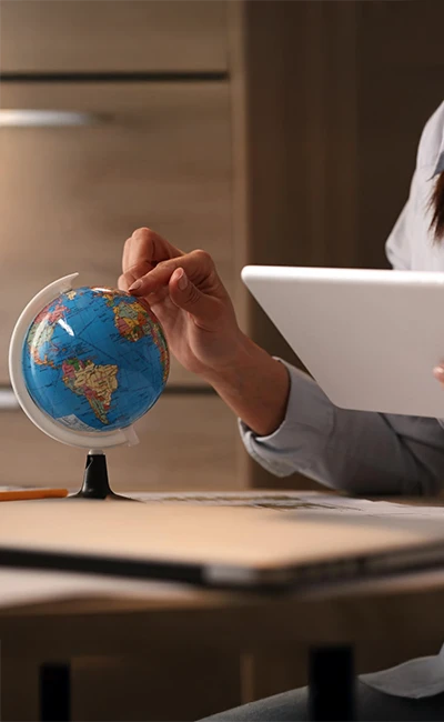 private-investigator-53b a woman touching a globe map